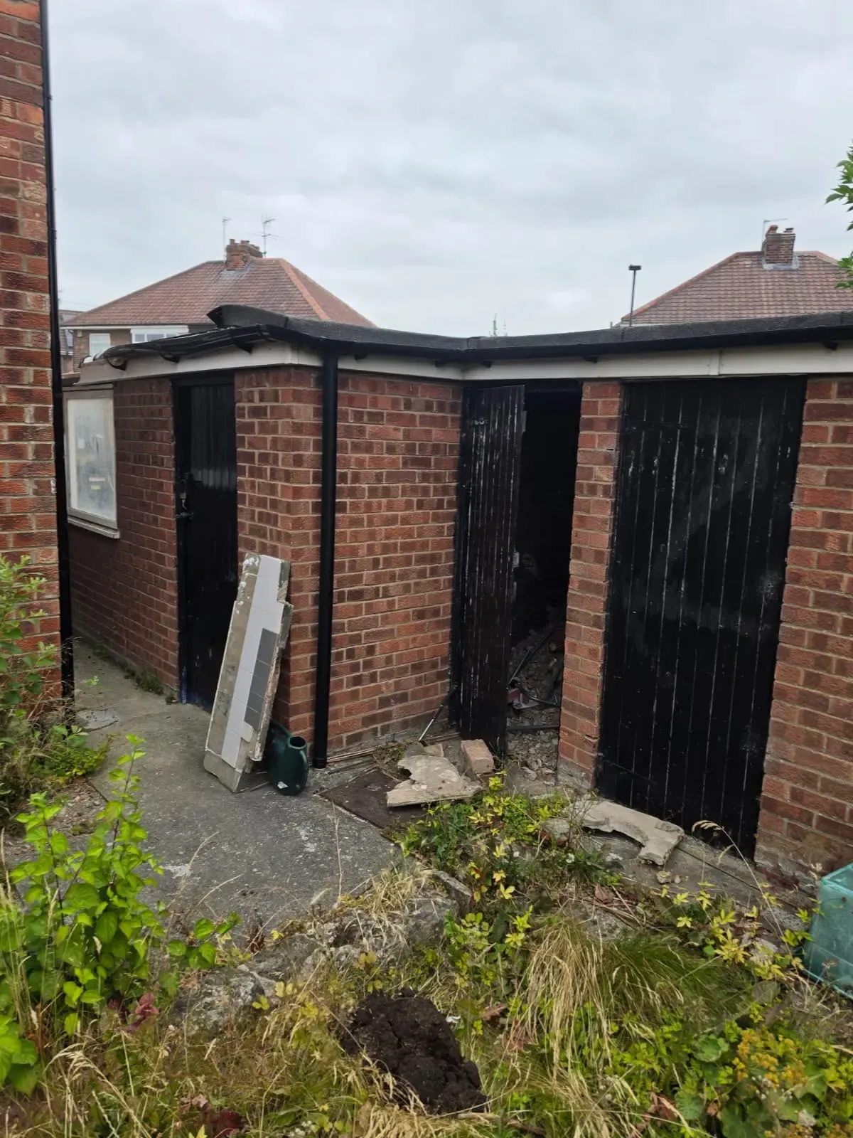Groundwork and drainage assessment area outside a brick outbuilding in York