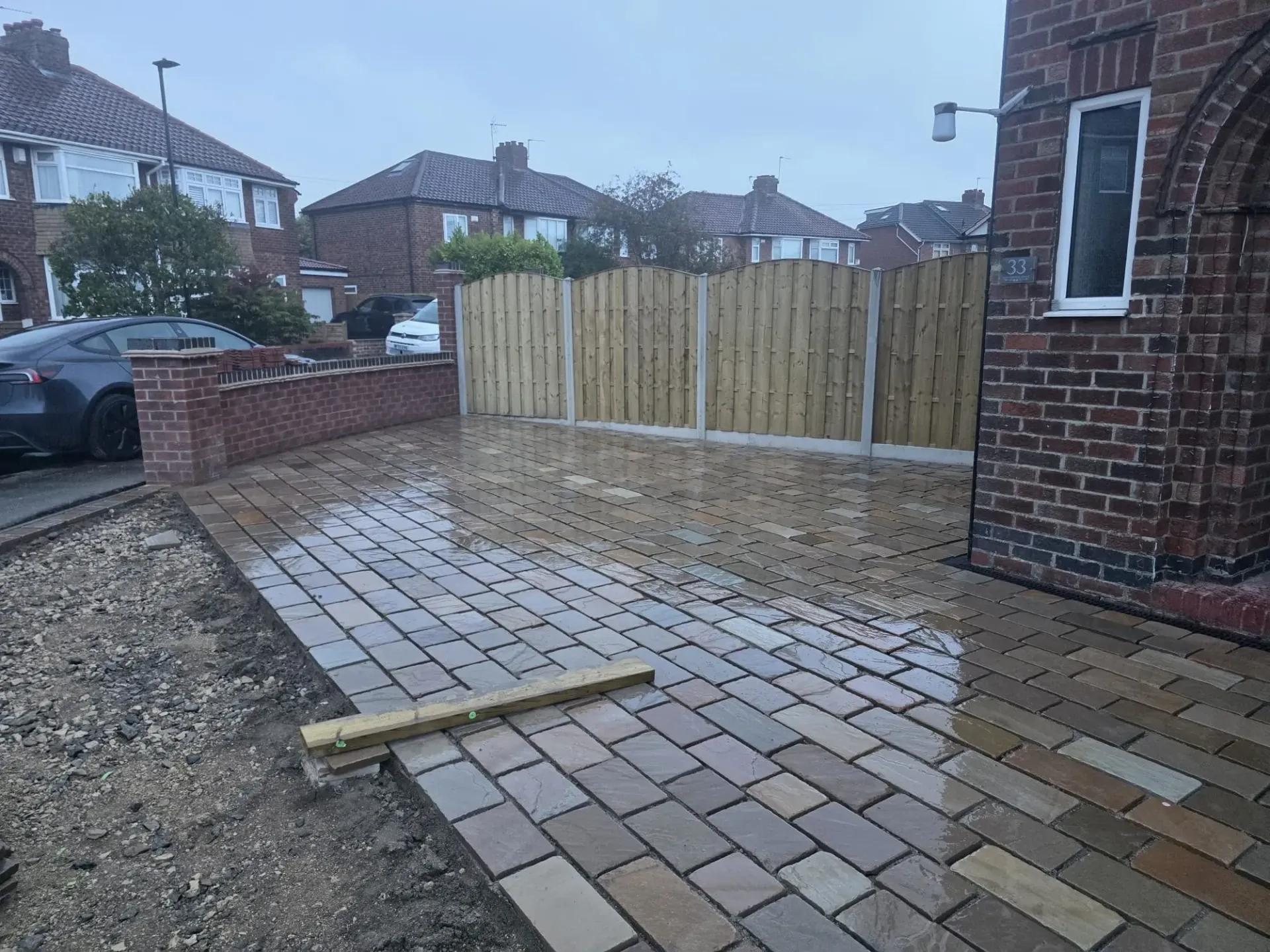Quality stone patio and driveway installation with integrated surface water drainage in York
