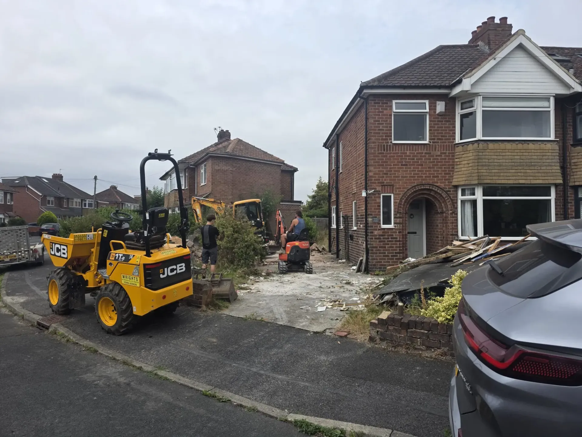 Future Drainage and Groundwork LTD team carrying out residential groundwork and driveway excavation using a JCB dumper and mini digger in York