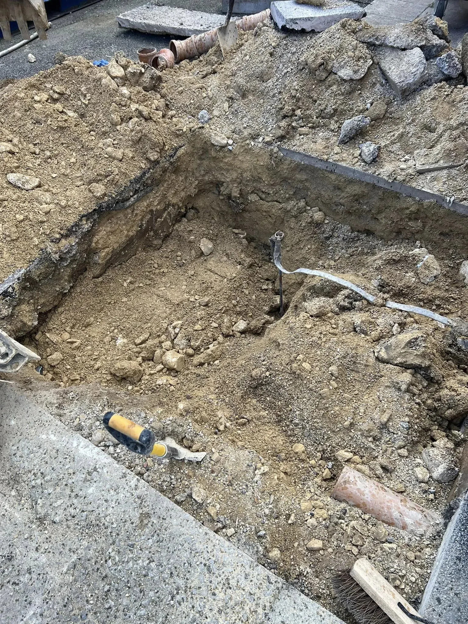Professional groundwork setup with excavated trench ready for drainage laying in North Yorkshire